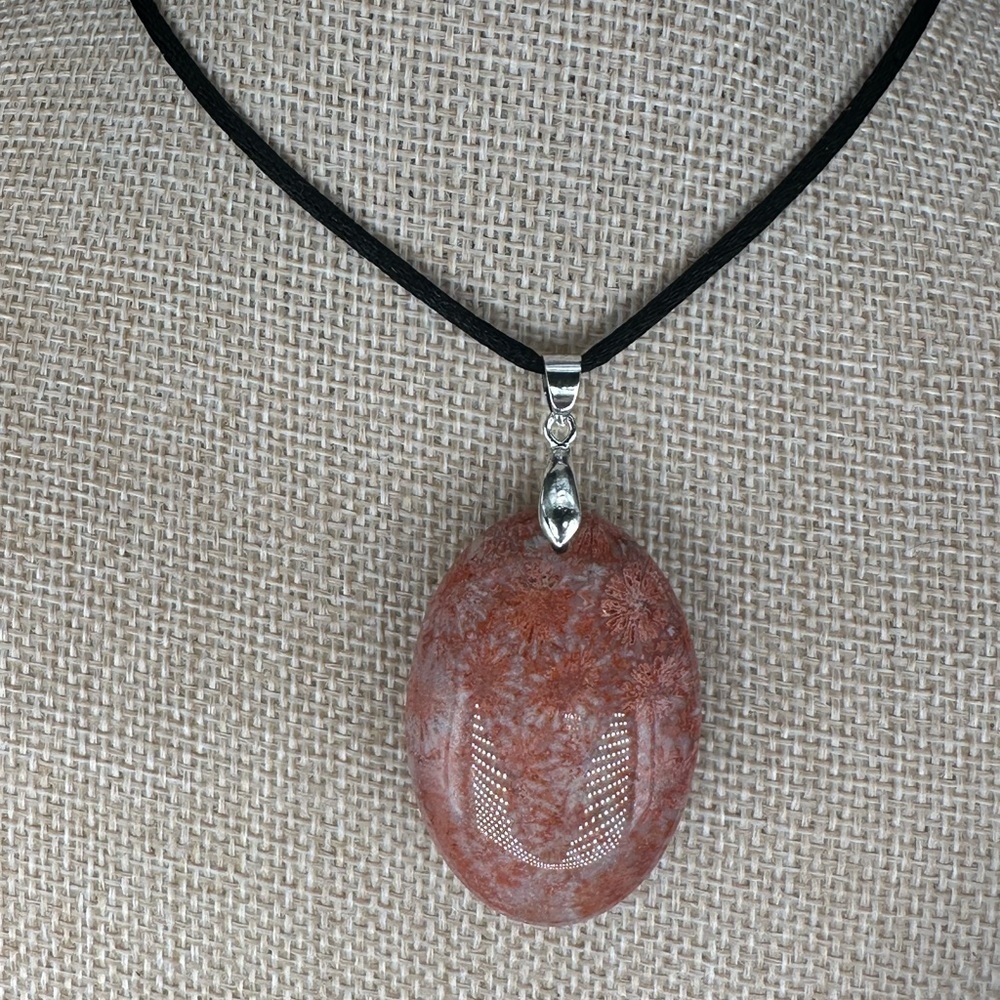 Orange and Pink/Lavender Coral Fossil Oval Pendant on Black Satin Rope